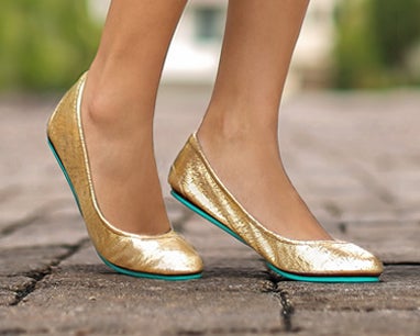 golden glitz tieks flats on feet