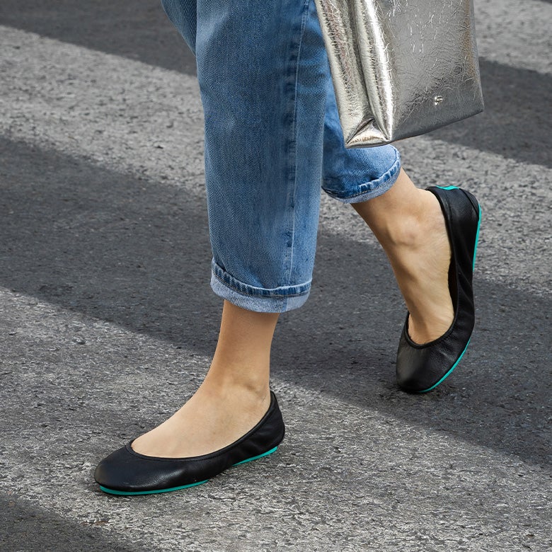 classic black ballet flats styled with jeans