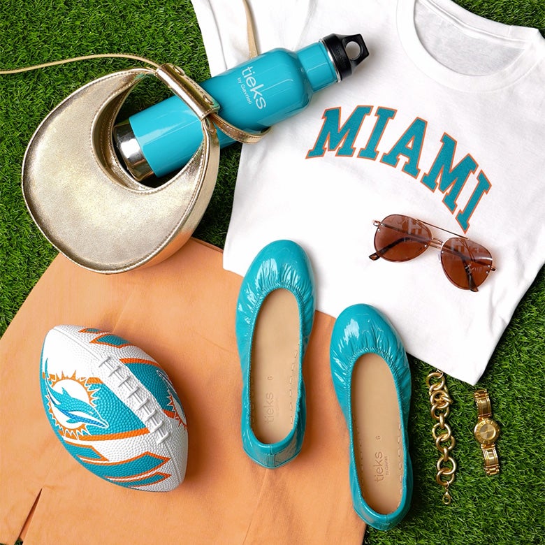 tiek blue patent tieks flats styled with a miami dolphins themed outfit 